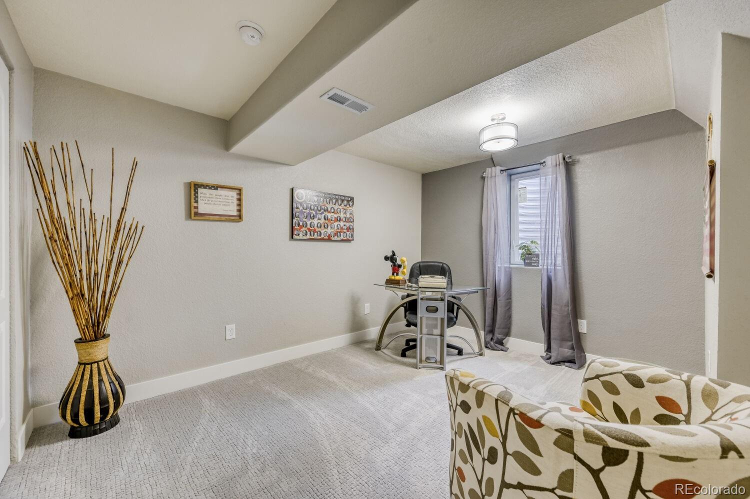 6623 Kipling Street Arvada, CO 80004 - Photo 25 of 39 a view of a room with gym equipment