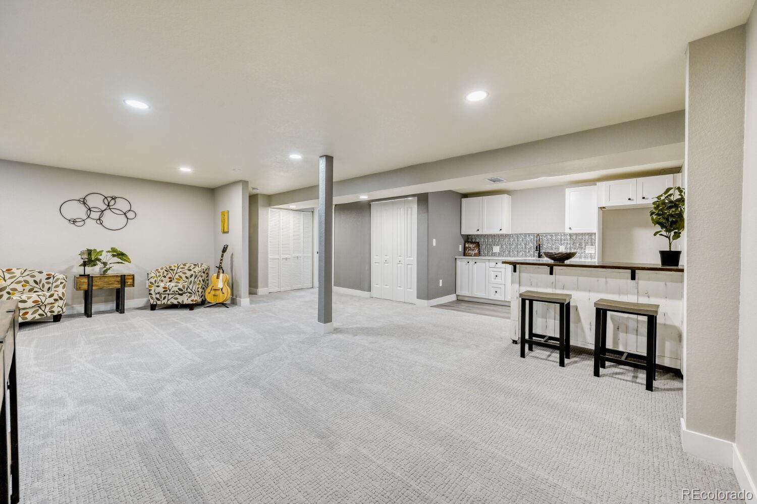 6623 Kipling Street Arvada, CO 80004 - Photo 28 of 39 a view of kitchen with furniture and refrigerator