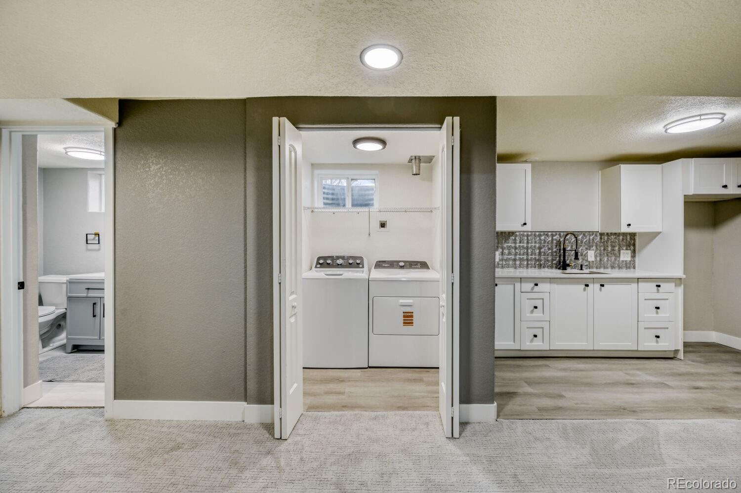 6623 Kipling Street Arvada, CO 80004 - Photo 32 of 39 a view of a hallway with closet and entryway