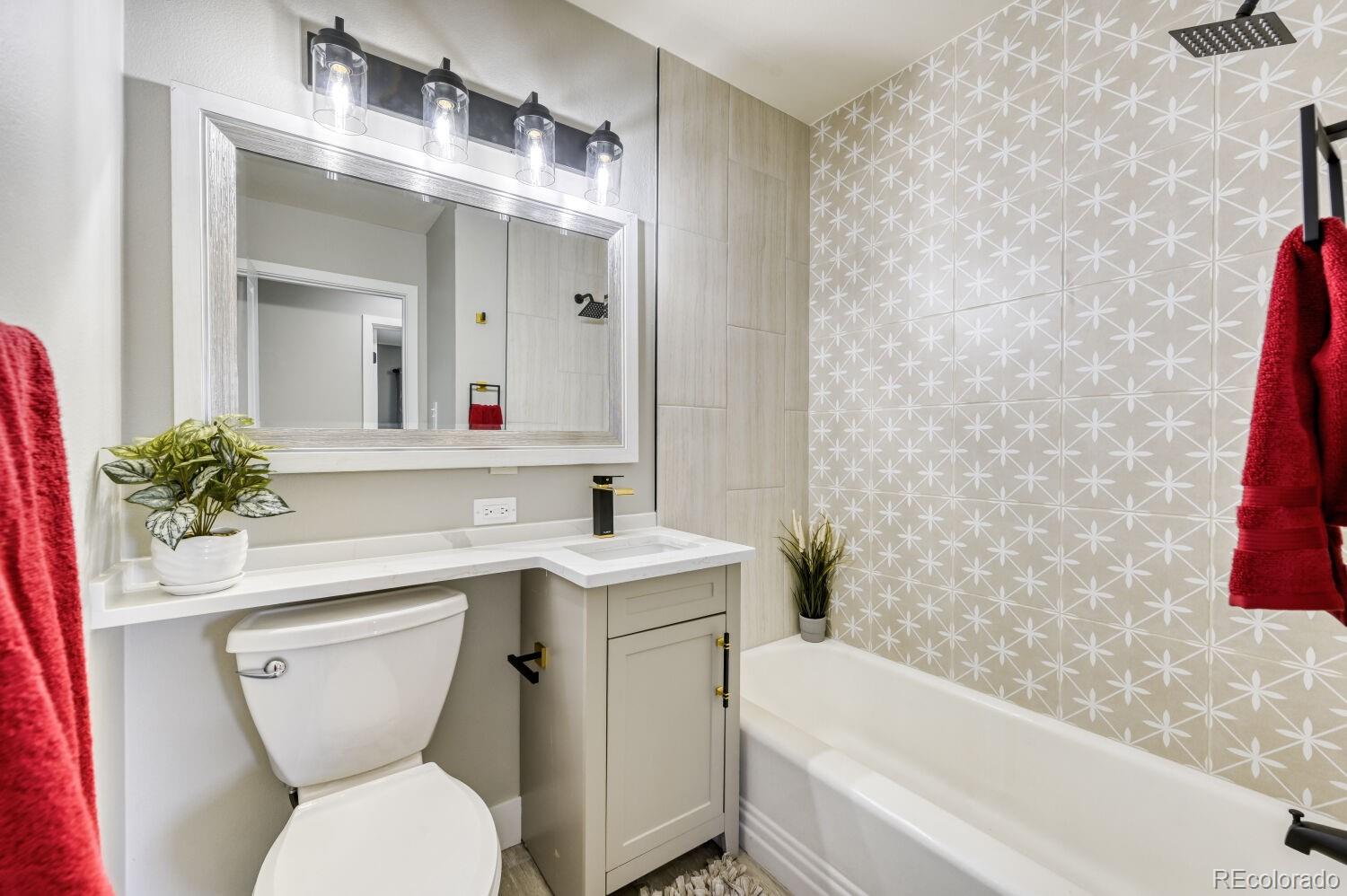 6623 Kipling Street Arvada, CO 80004 - Photo 33 of 39 a bathroom with a sink toilet and shower