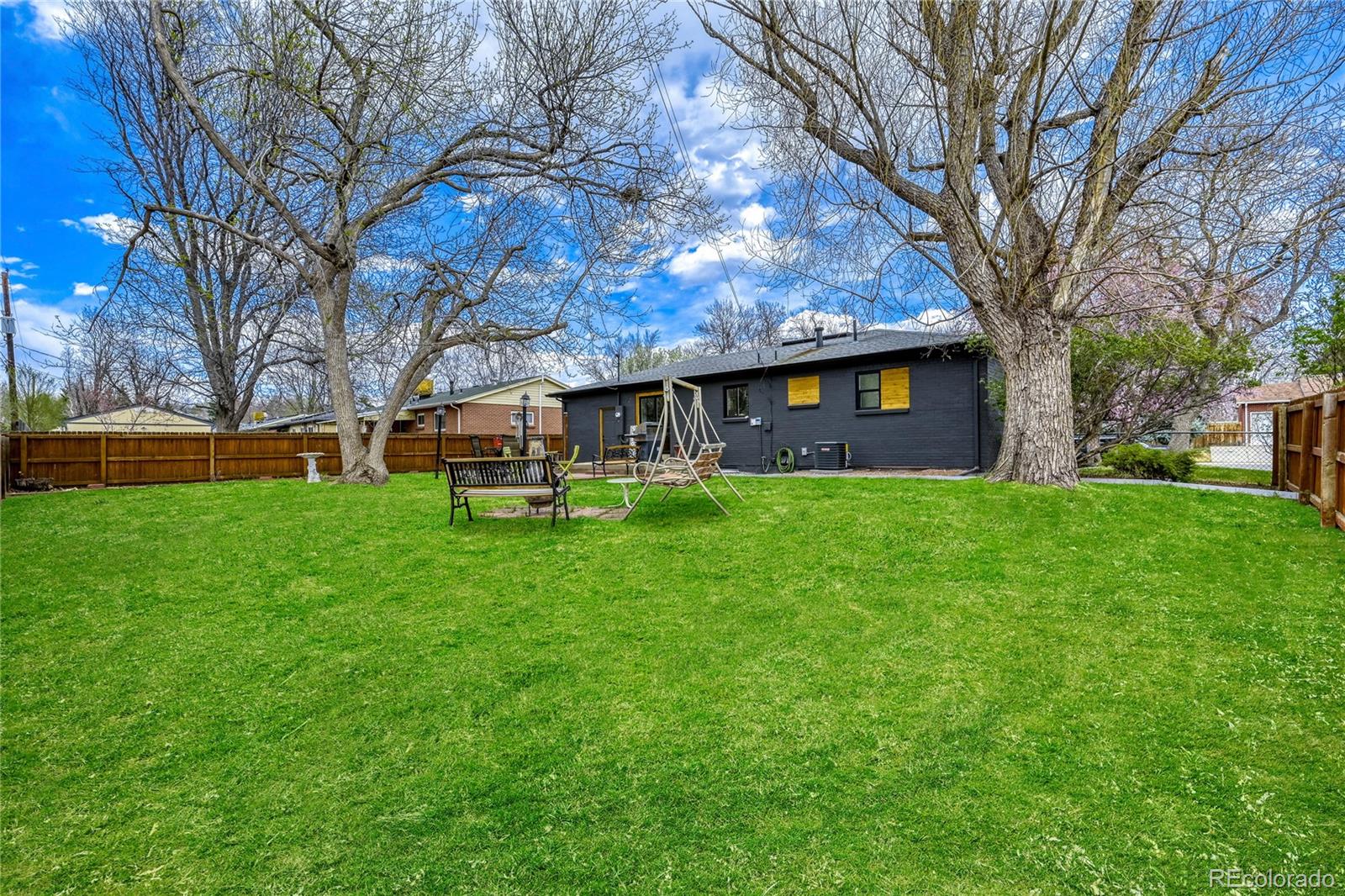 6623 Kipling Street Arvada, CO 80004 - Photo 37 of 39 a view of a building with a yard