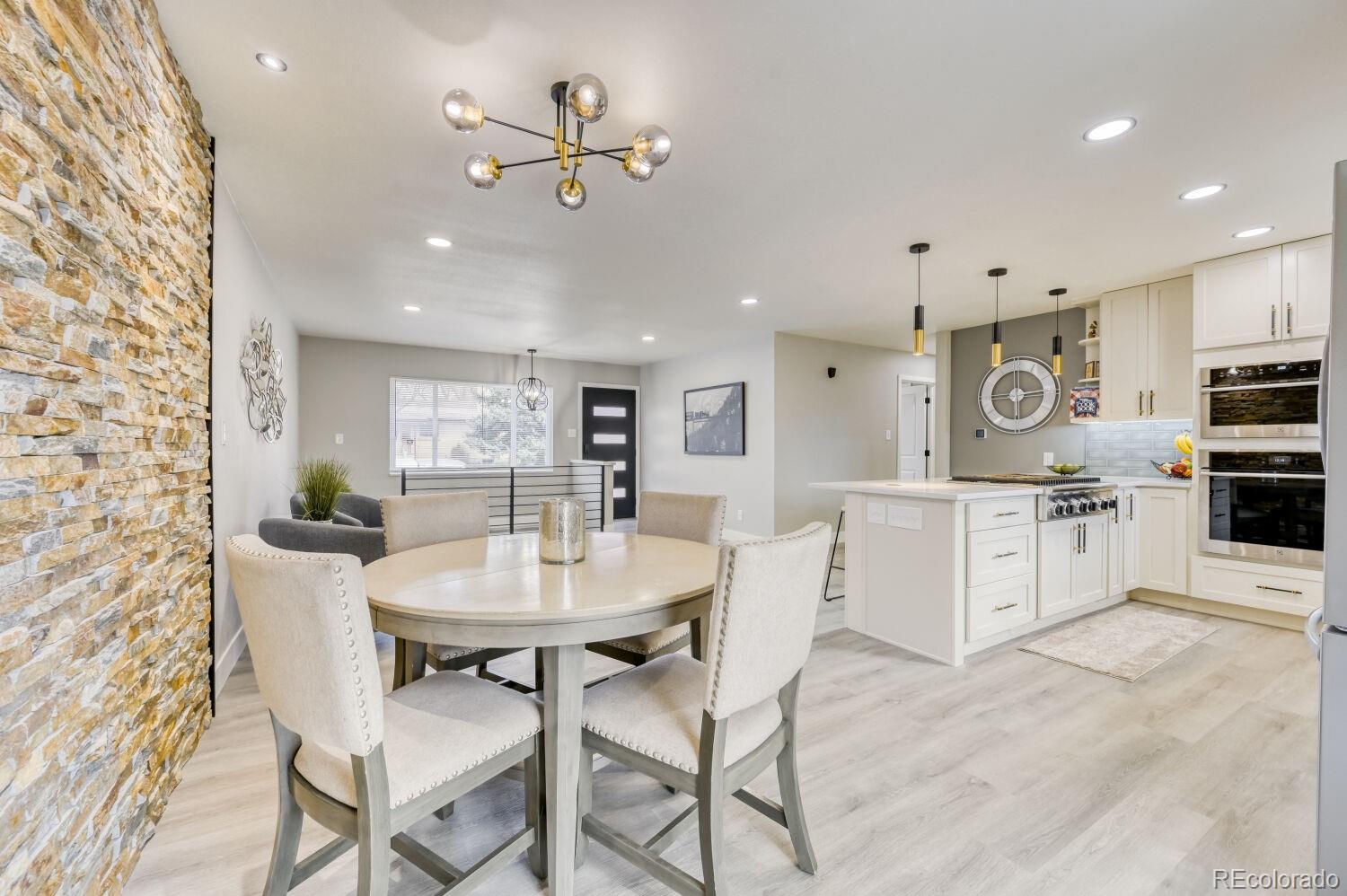 6623 Kipling Street Arvada, CO 80004 - Photo 10 of 39 a view of a dining room with furniture