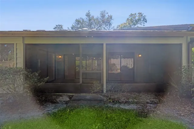 a view of a house with a yard and garden