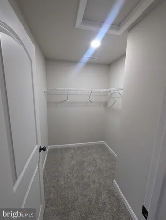 a view of storage and utility room with empty racks