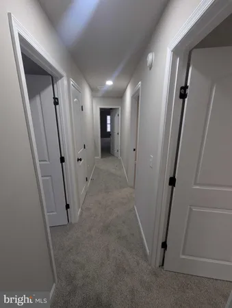 a view of an empty room and a window