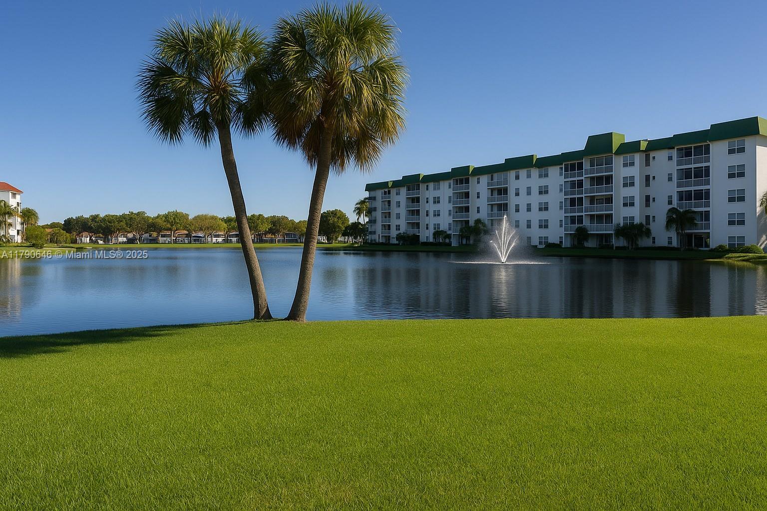 4881 Northwest 22nd Street, Unit B7 Lauderhill, FL 33313 - Photo 1 of 13 a view of a lake with a big yard and large trees