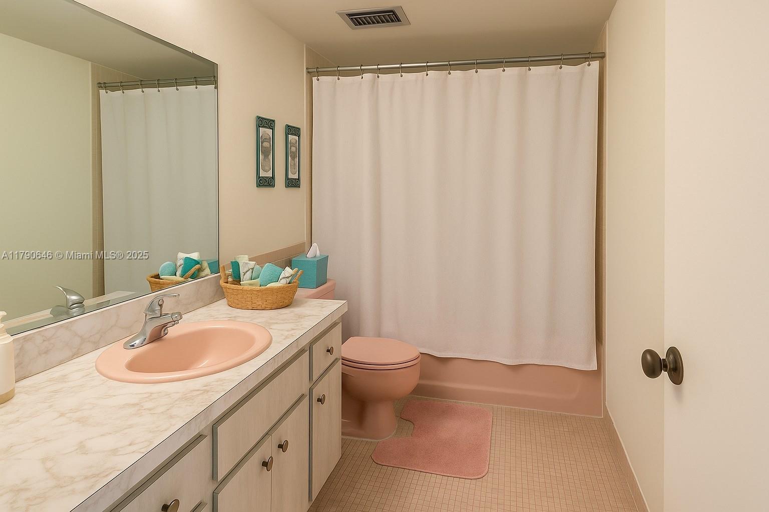 4881 Northwest 22nd Street, Unit B7 Lauderhill, FL 33313 - Photo 5 of 13 a bathroom with a sink a toilet and shower curtain