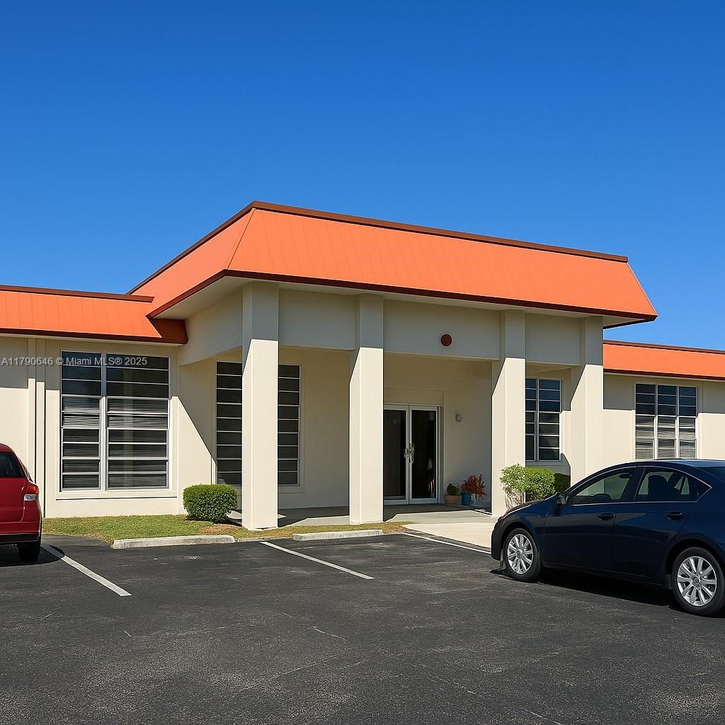 4881 Northwest 22nd Street, Unit B7 Lauderhill, FL 33313 - Photo 7 of 13 a car parked in front of a house