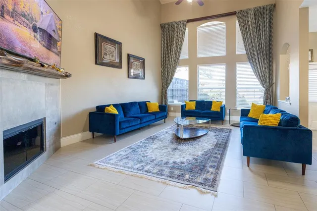 a living room with furniture and a fireplace