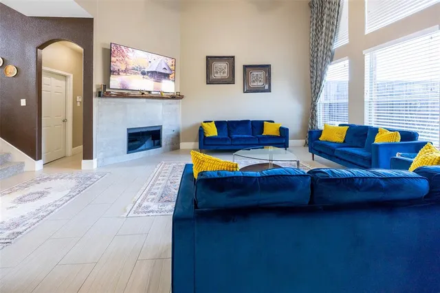 a living room with furniture and a fireplace