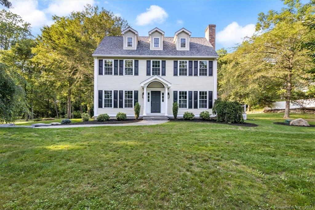 1 Fordham Trail Old Saybrook, CT 06475 - Photo 1 of 1 a front view of a house with a yard