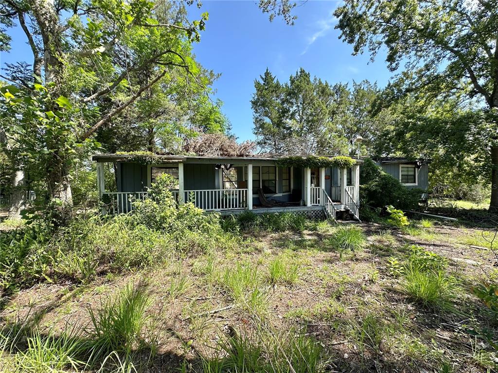 11192 Wren Road Weeki Wachee, FL 34614 - Photo 5 of 12 a front view of a house with a yard