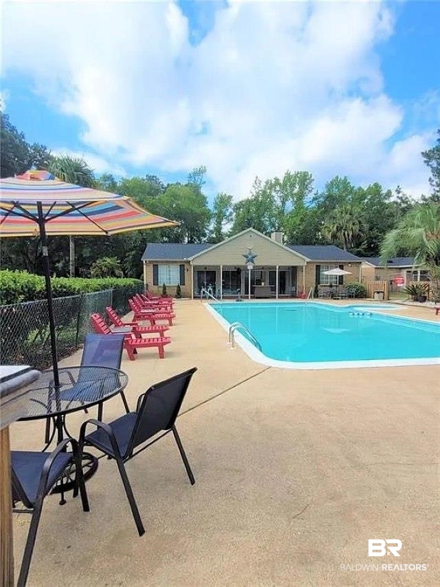 6701 Dickens Ferry Road, Unit 53 Mobile, AL 36608 - Photo 21 of 23 Community pool with a patio area