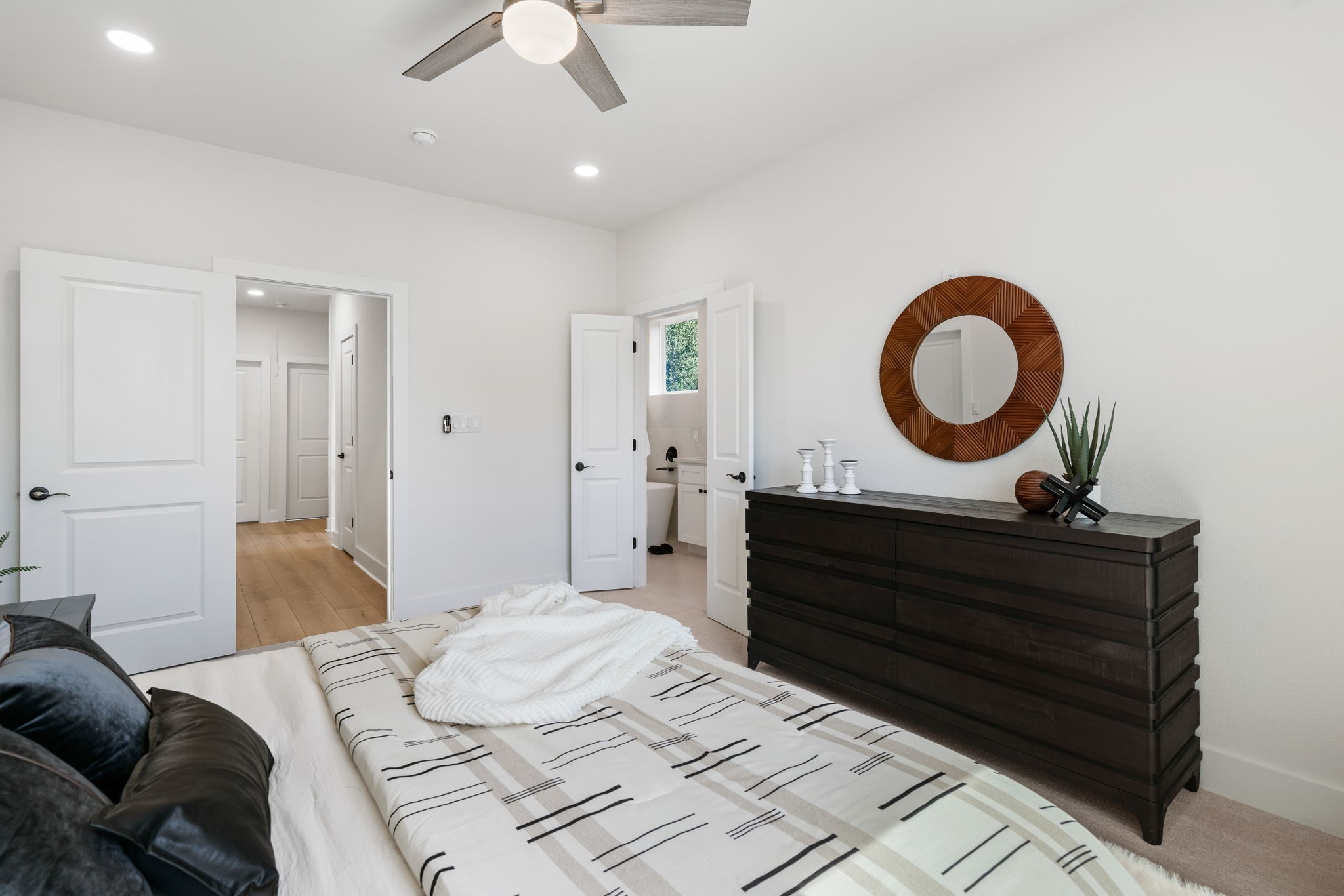 22806 August Leaf Drive Tomball, TX 77375 - Photo 17 of 34 a living room with a bed furniture and a dresser