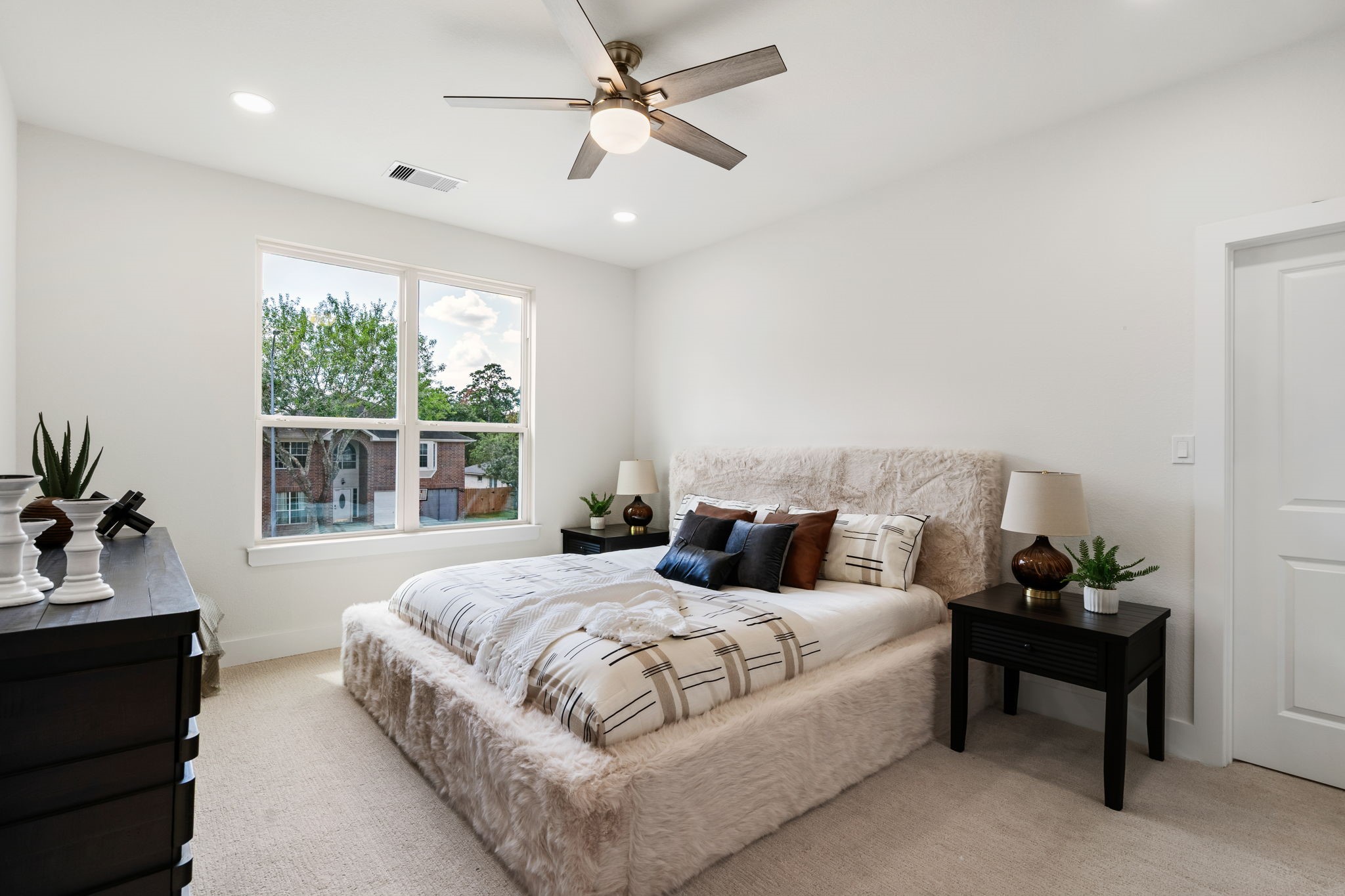 22806 August Leaf Drive Tomball, TX 77375 - Photo 18 of 34 a bedroom with bed and a potted plant