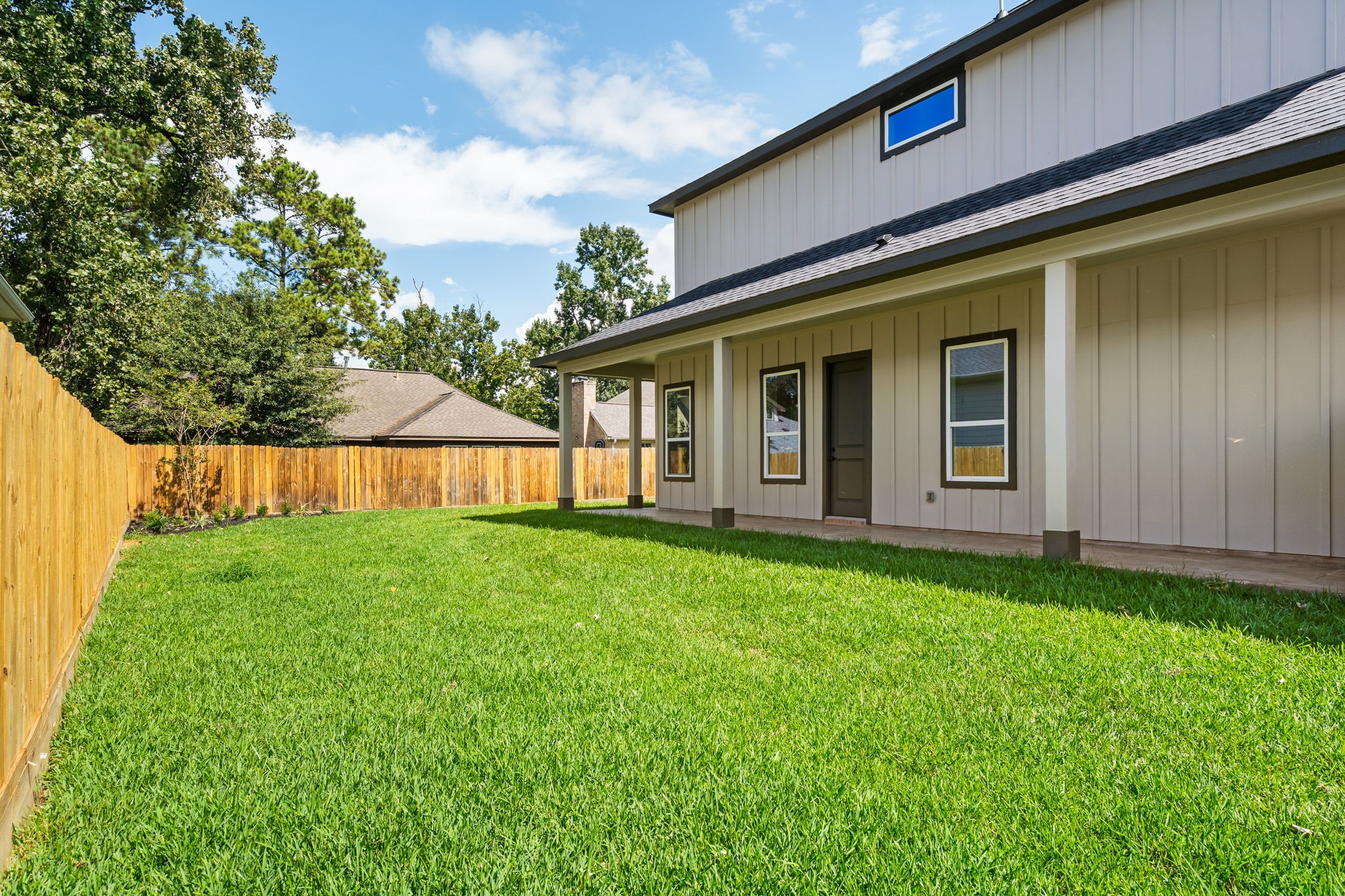 22806 August Leaf Drive Tomball, TX 77375 - Photo 29 of 34 a view of a house with backyard and porch
