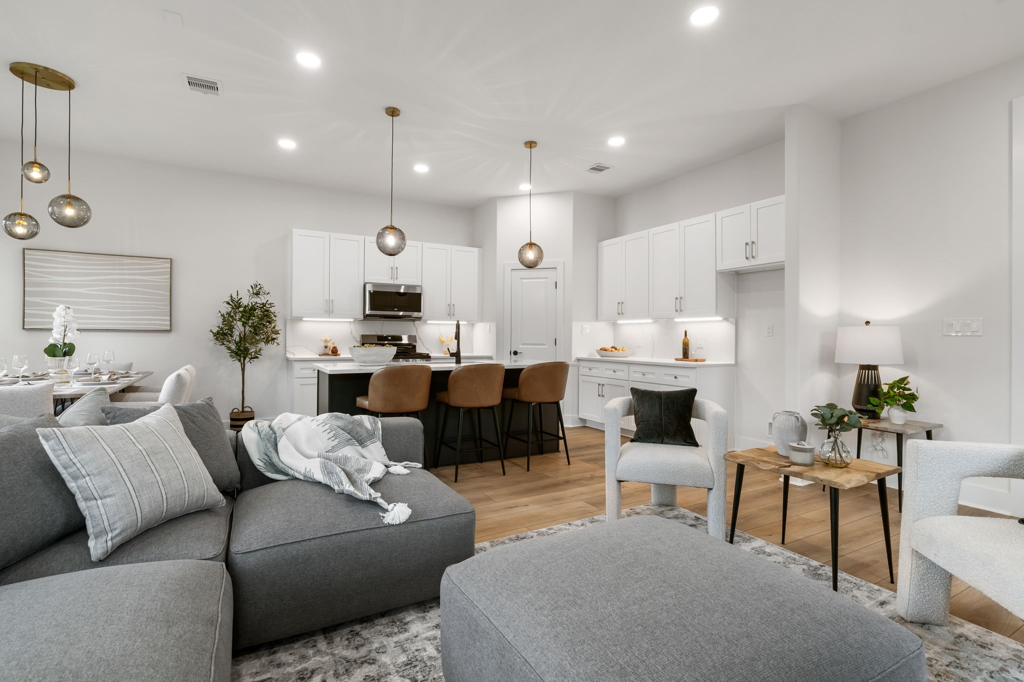 22806 August Leaf Drive Tomball, TX 77375 - Photo 7 of 34 a living room with furniture kitchen view and a large window