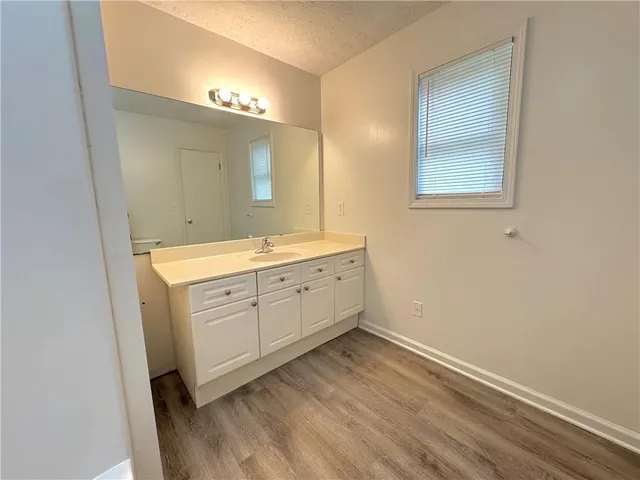 a room with a white cabinets and sink