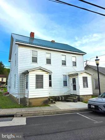 a view of a house with a street