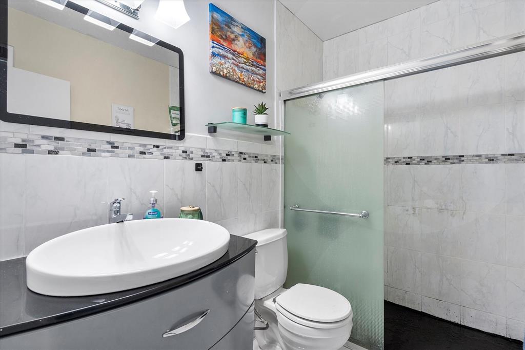 900 Atlantic Shores Boulevard, Unit 209 Hallandale Beach, FL 33009 - Photo 12 of 20 a bathroom with a sink toilet and shower