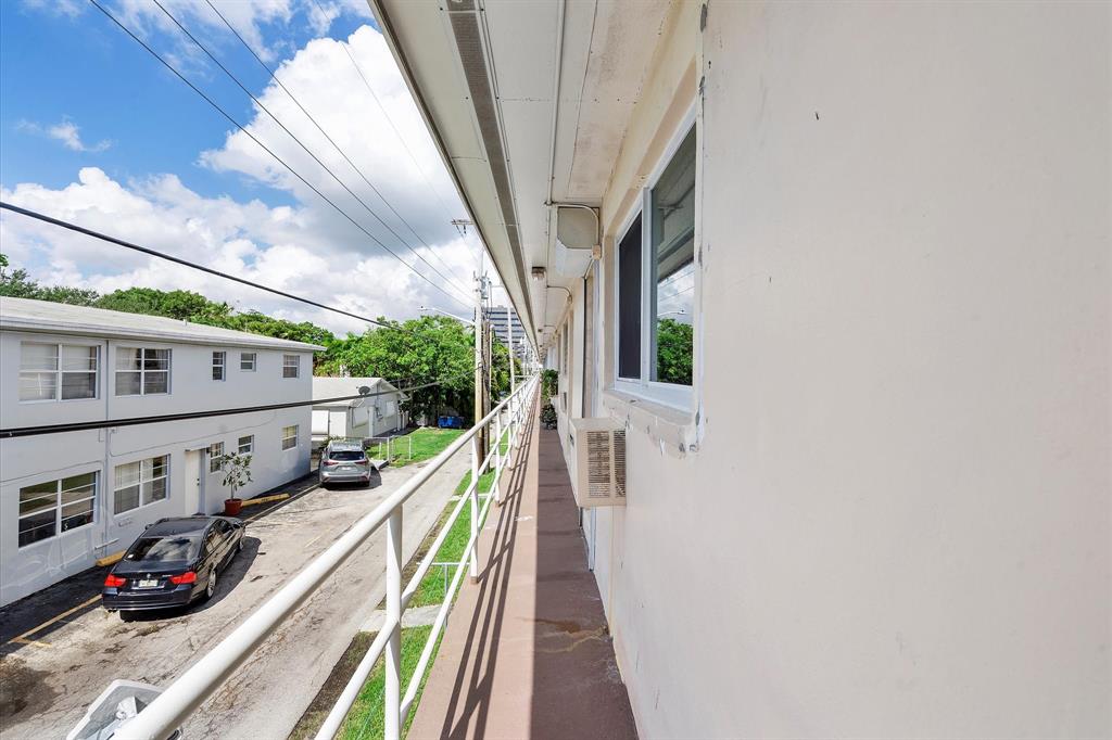 900 Atlantic Shores Boulevard, Unit 209 Hallandale Beach, FL 33009 - Photo 14 of 20 a view of a balcony with car parked