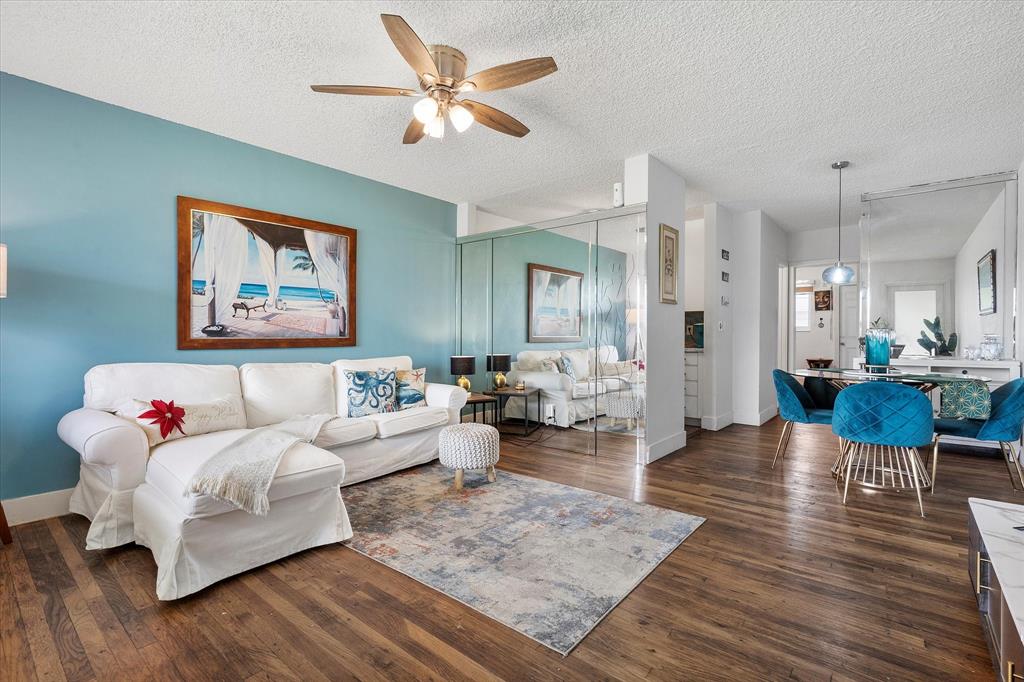 900 Atlantic Shores Boulevard, Unit 209 Hallandale Beach, FL 33009 - Photo 2 of 20 a living room with furniture and wooden floor