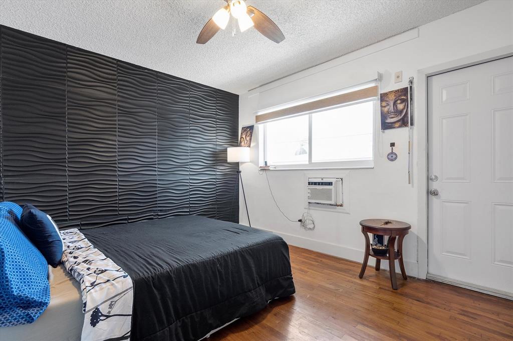 900 Atlantic Shores Boulevard, Unit 209 Hallandale Beach, FL 33009 - Photo 8 of 20 a bedroom with a bed and a table in it