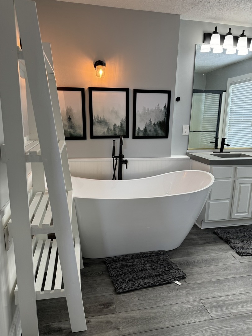 561 County Road 2000 East Secor, IL 61771 - Photo 21 of 37 a white bath tub sitting next to a bathroom sink
