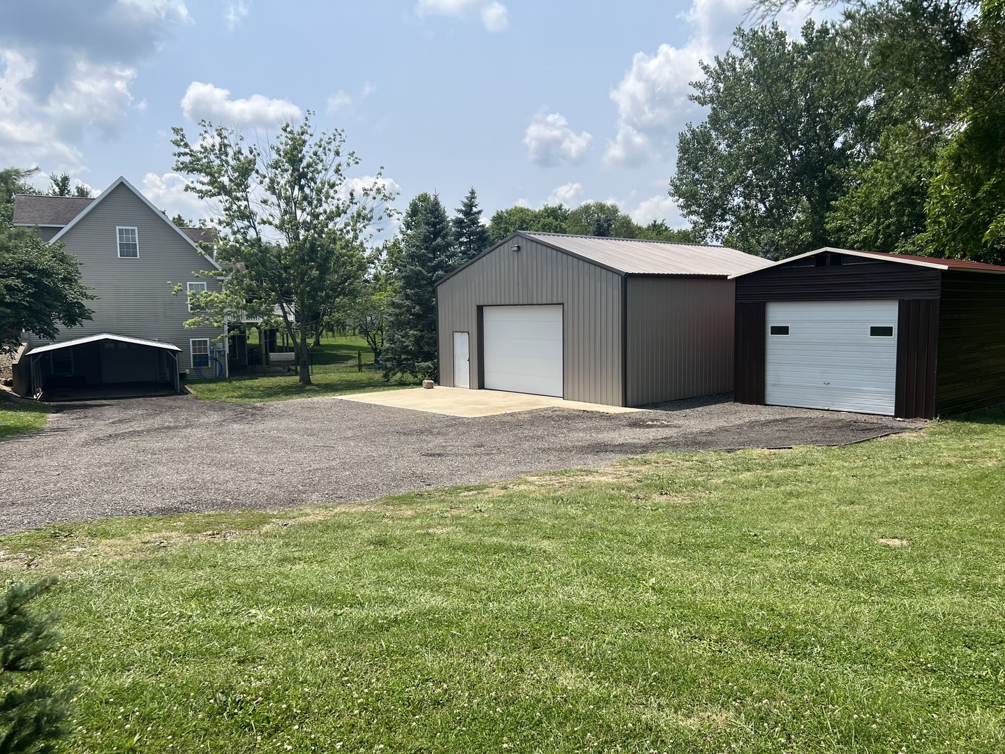 561 County Road 2000 East Secor, IL 61771 - Photo 3 of 37 a front view of a house with a yard and garage