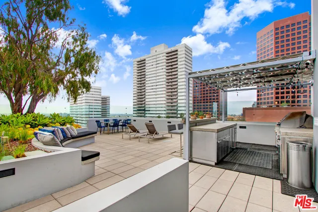 a view of a patio with couches and potted plants