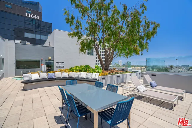 a view of table and chairs in patio