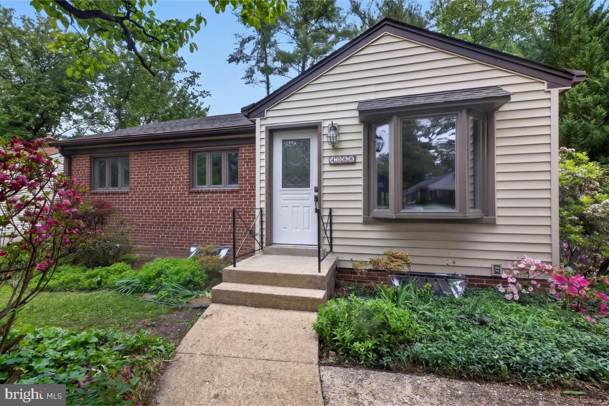 4068 Adams Drive Silver Spring, MD 20902 - Photo 6 of 43 a front view of a house with a yard