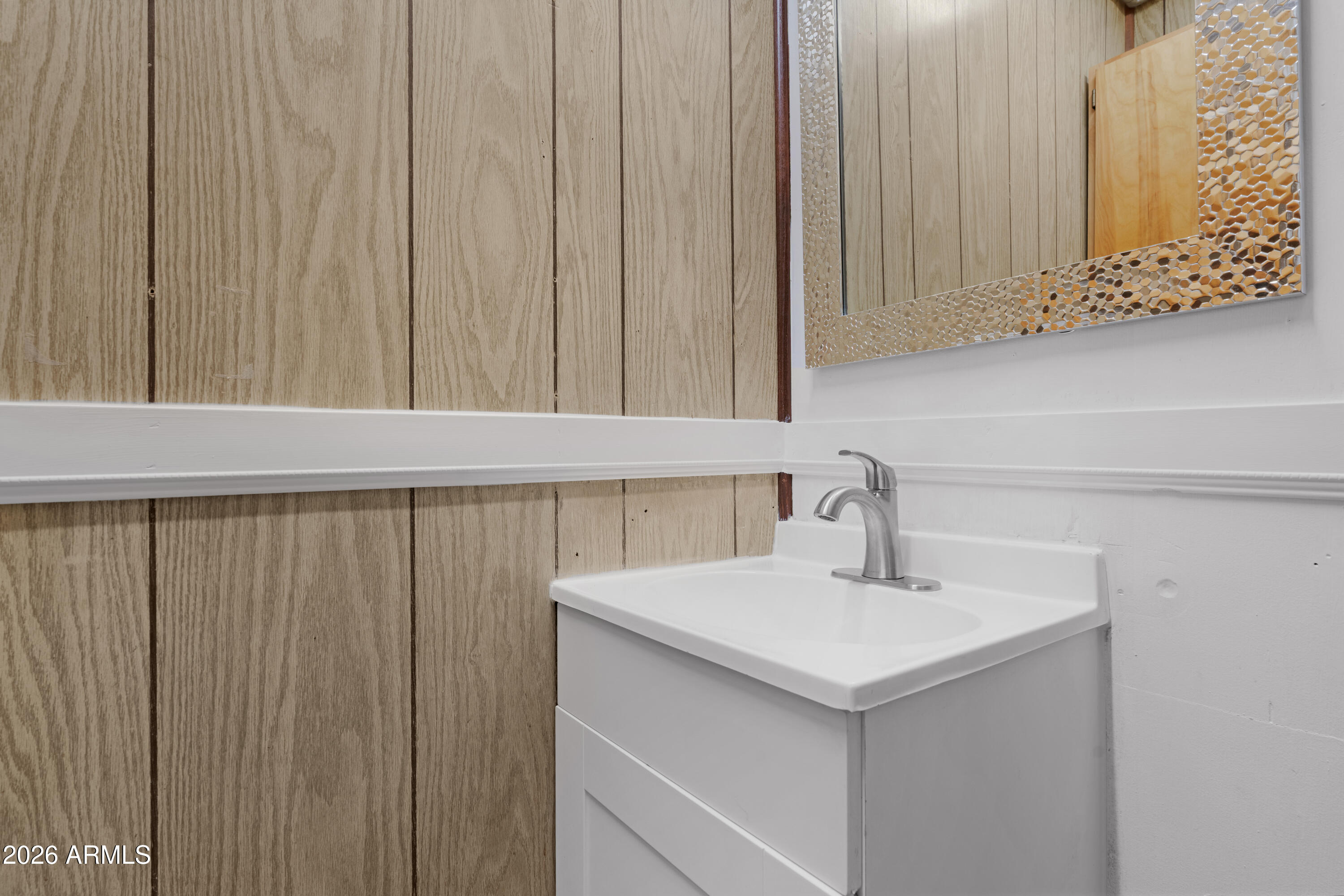 5437 East Butte Street Mesa, AZ 85205 - Photo 36 of 56 a bathroom with a sink and vanity