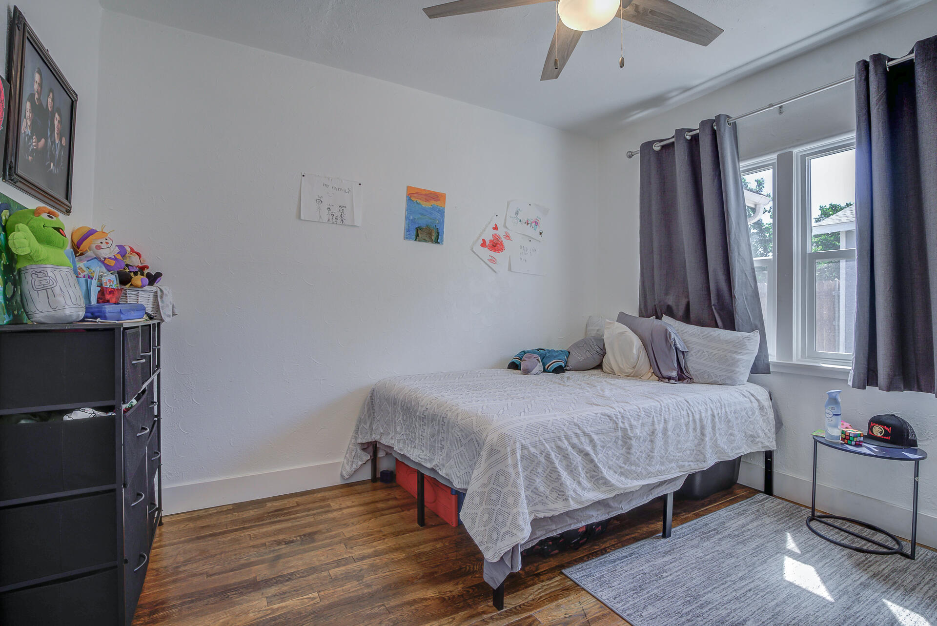 2962 Lanning Avenue Redding, CA 96001 - Photo 18 of 38 a bedroom with a bed and a chandelier