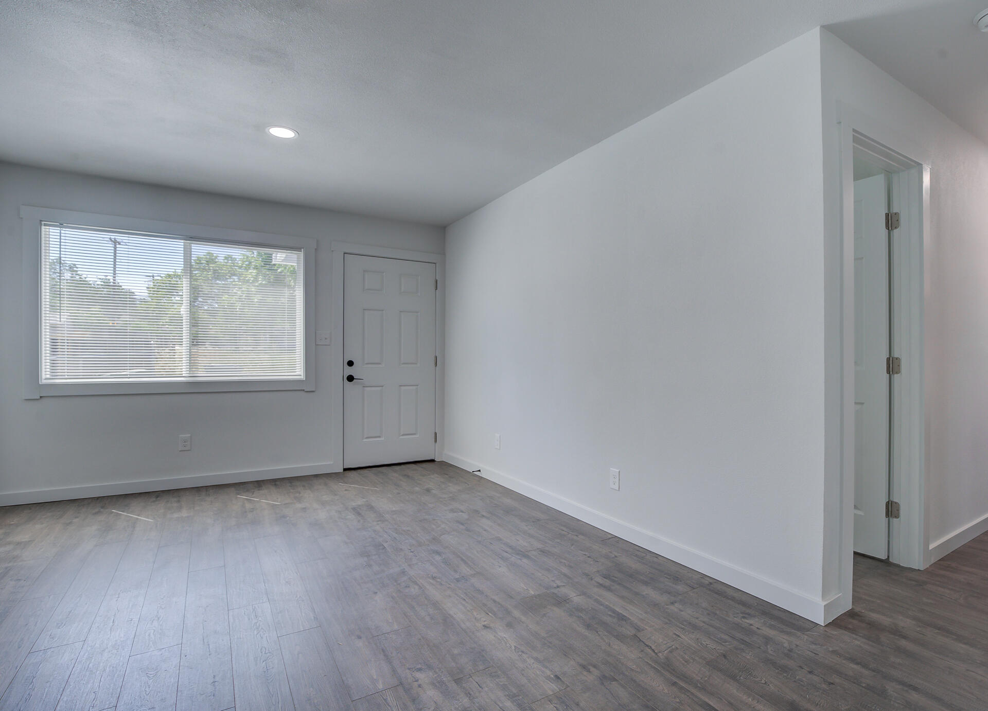 2962 Lanning Avenue Redding, CA 96001 - Photo 24 of 38 an empty room with wooden floor and windows
