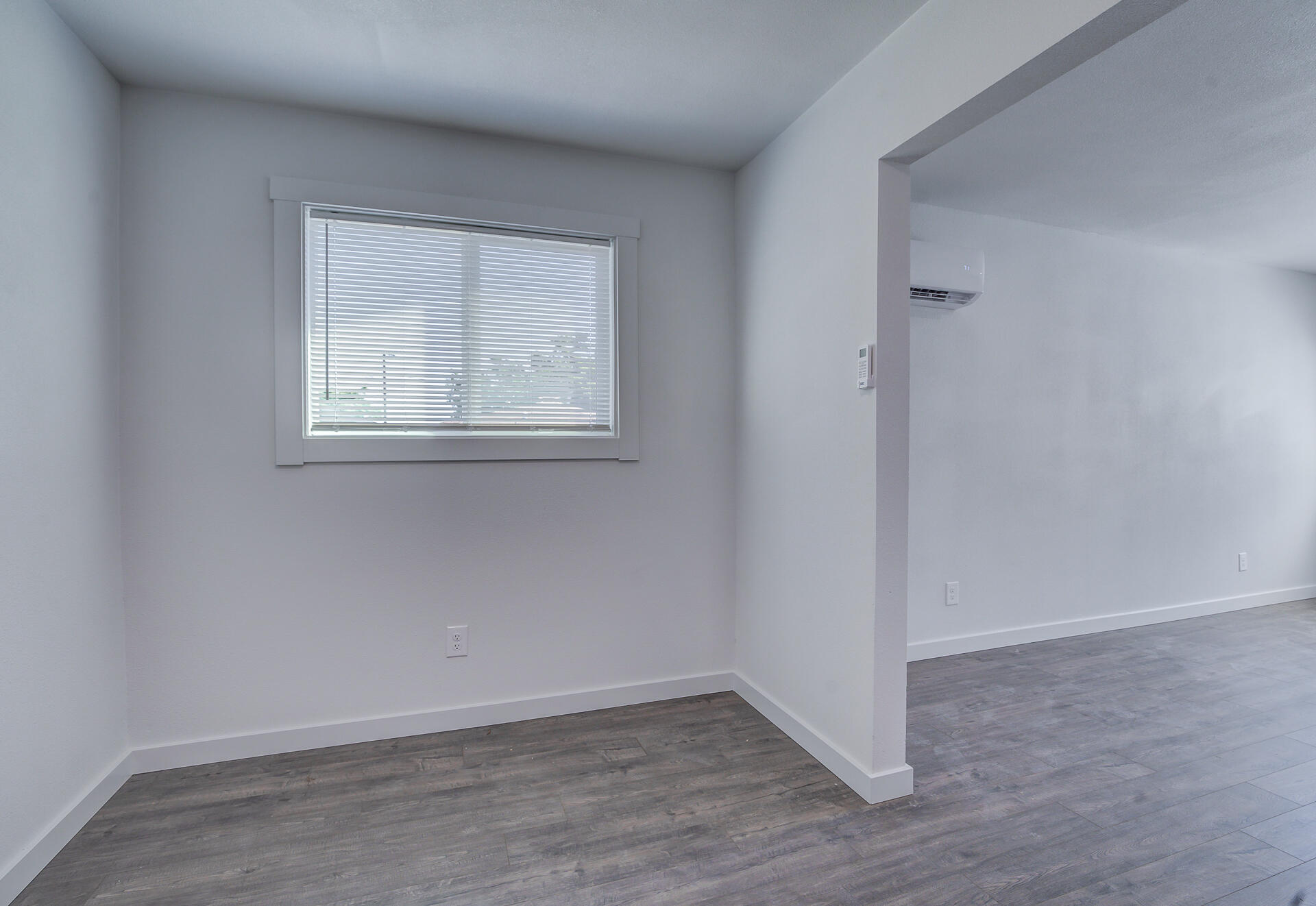 2962 Lanning Avenue Redding, CA 96001 - Photo 26 of 38 an empty room with wooden floor and windows