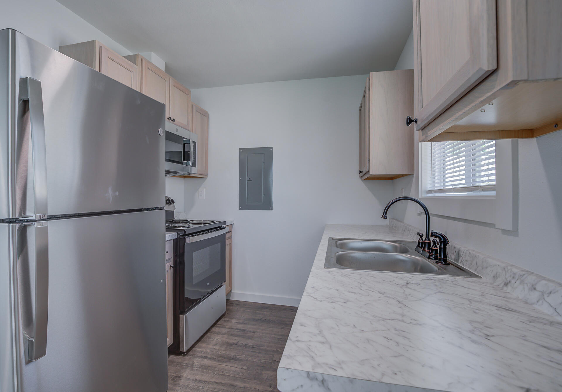 2962 Lanning Avenue Redding, CA 96001 - Photo 27 of 38 a kitchen with stainless steel appliances granite countertop a refrigerator and a sink