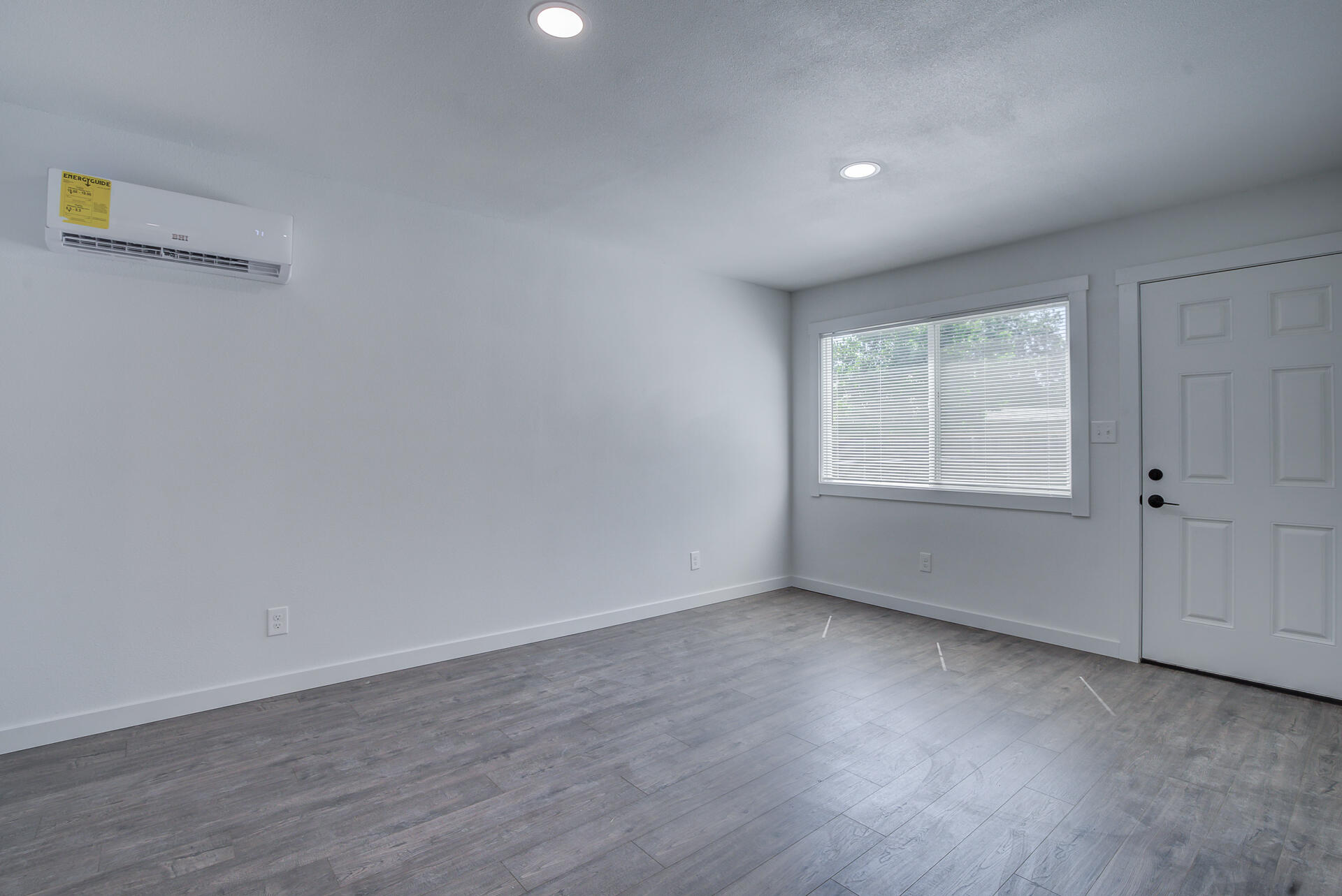 2962 Lanning Avenue Redding, CA 96001 - Photo 30 of 38 an empty room with wooden floor and windows