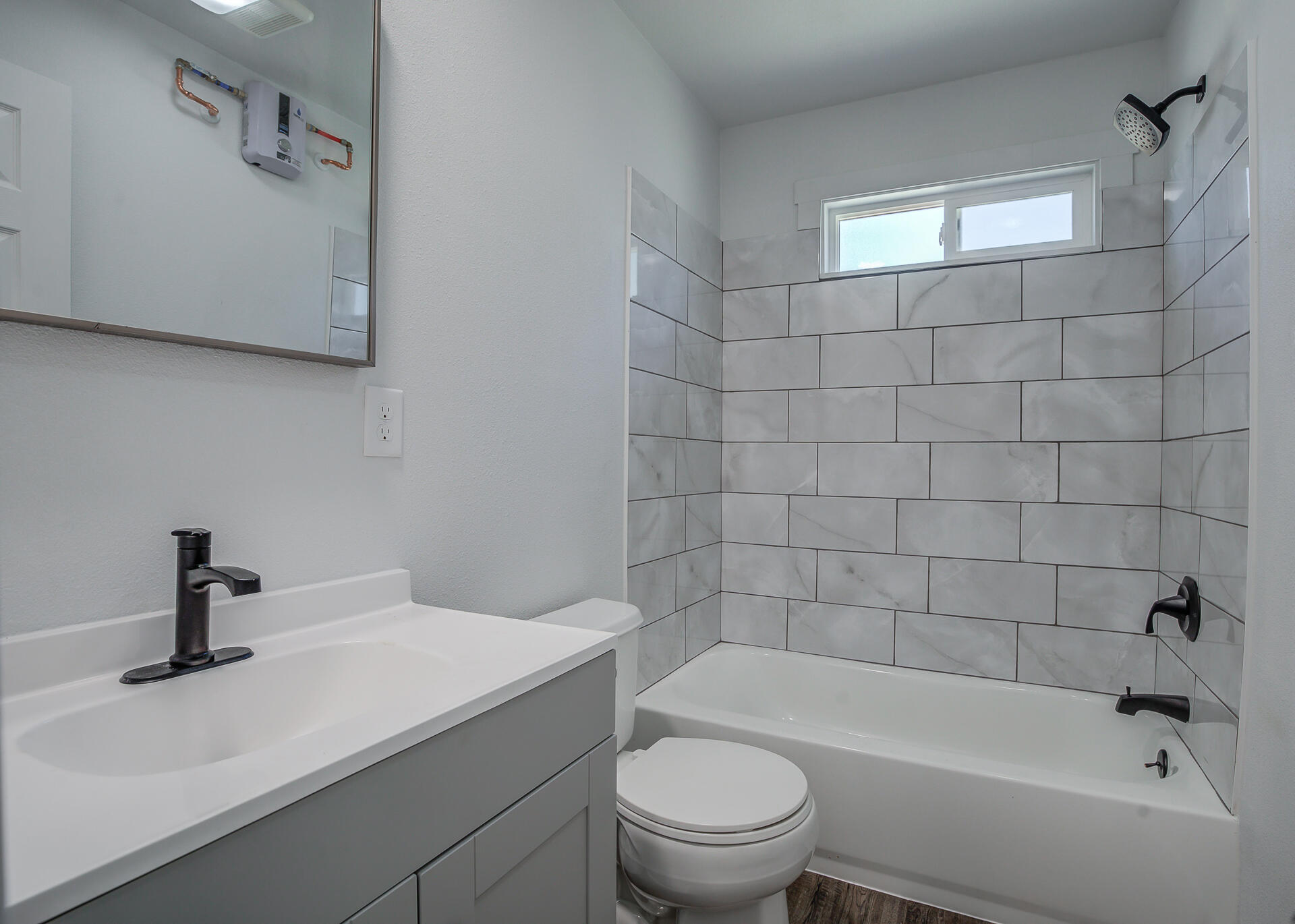 2962 Lanning Avenue Redding, CA 96001 - Photo 35 of 38 a bathroom with a sink a toilet and bathtub