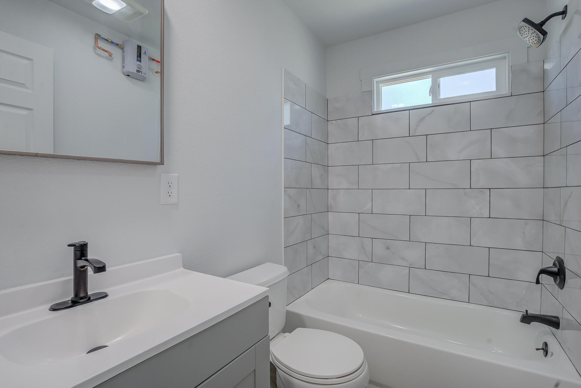 2962 Lanning Avenue Redding, CA 96001 - Photo 36 of 38 a bathroom with a sink a toilet and bathtub
