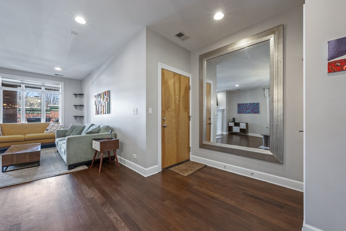 1025 West Monroe Street, Unit 3W Chicago, IL 60607 - Photo 2 of 19 a living room with furniture and a wooden floor