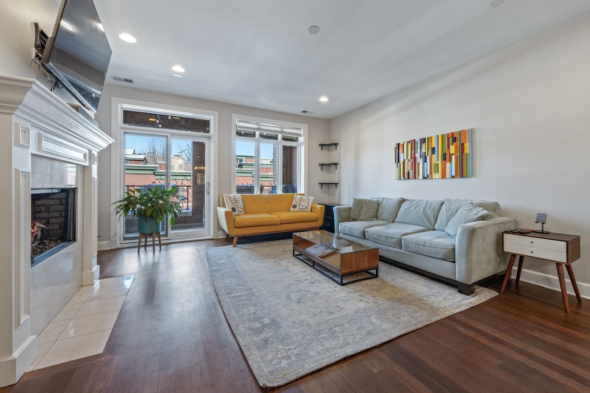 1025 West Monroe Street, Unit 3W Chicago, IL 60607 - Photo 5 of 19 a living room with furniture and a flat screen tv