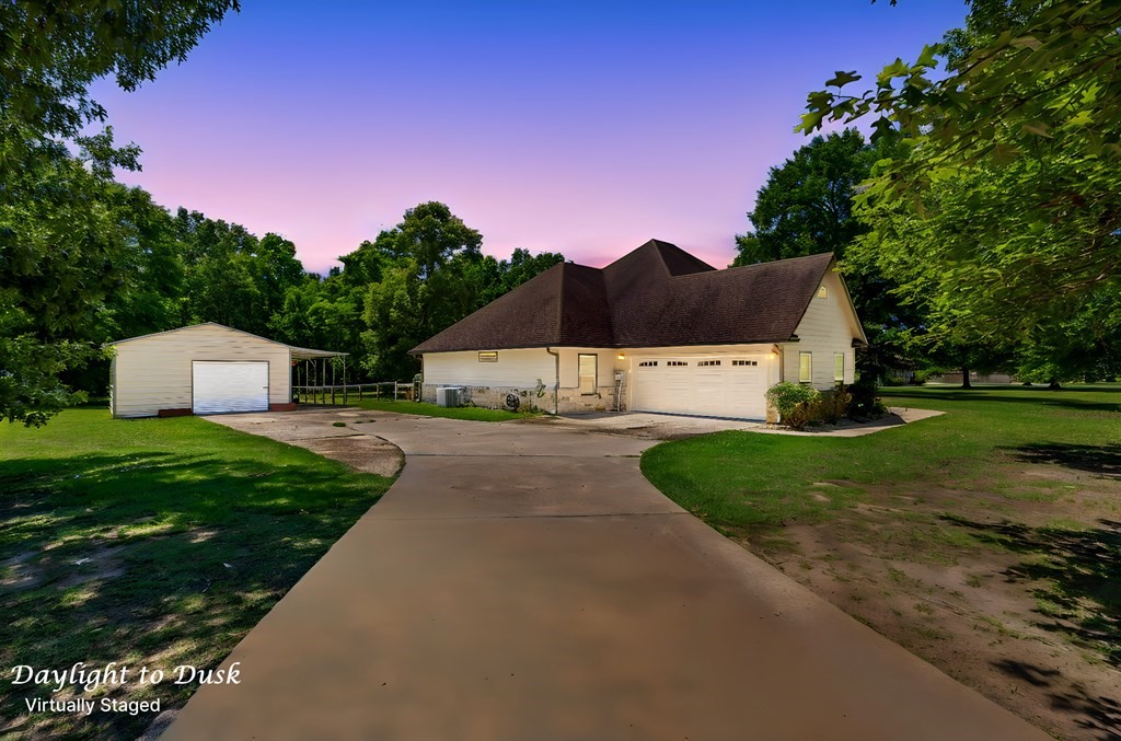 1171 Old Ewing Road Lufkin, TX 75901 - Photo 39 of 49 a front view of a house with a yard and garage