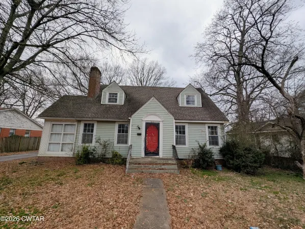 a front view of a house with yard