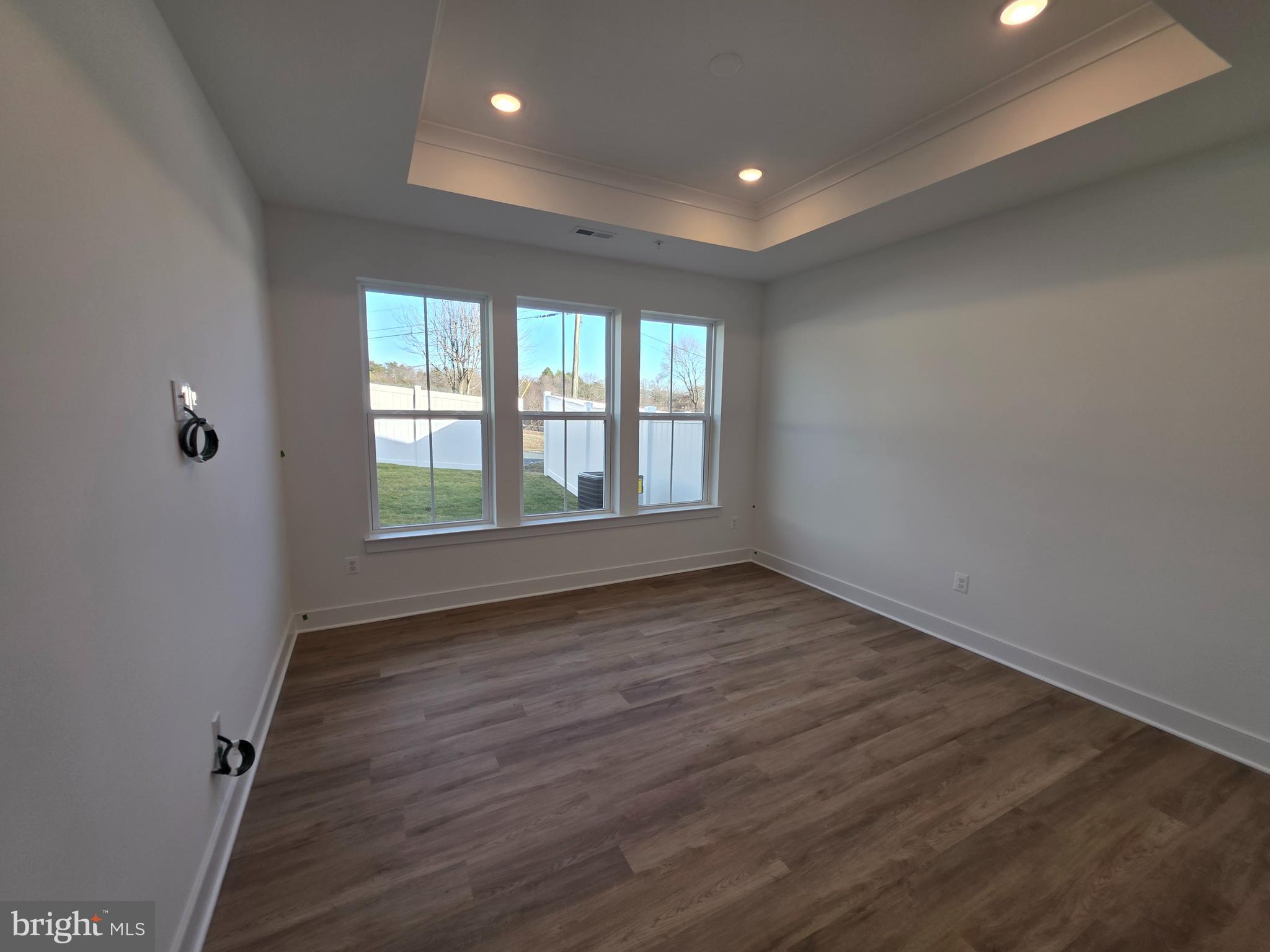 4817 Grandiflora Circle Perry Hall, MD 21128 - Photo 22 of 35 wooden floor in an empty room with a window