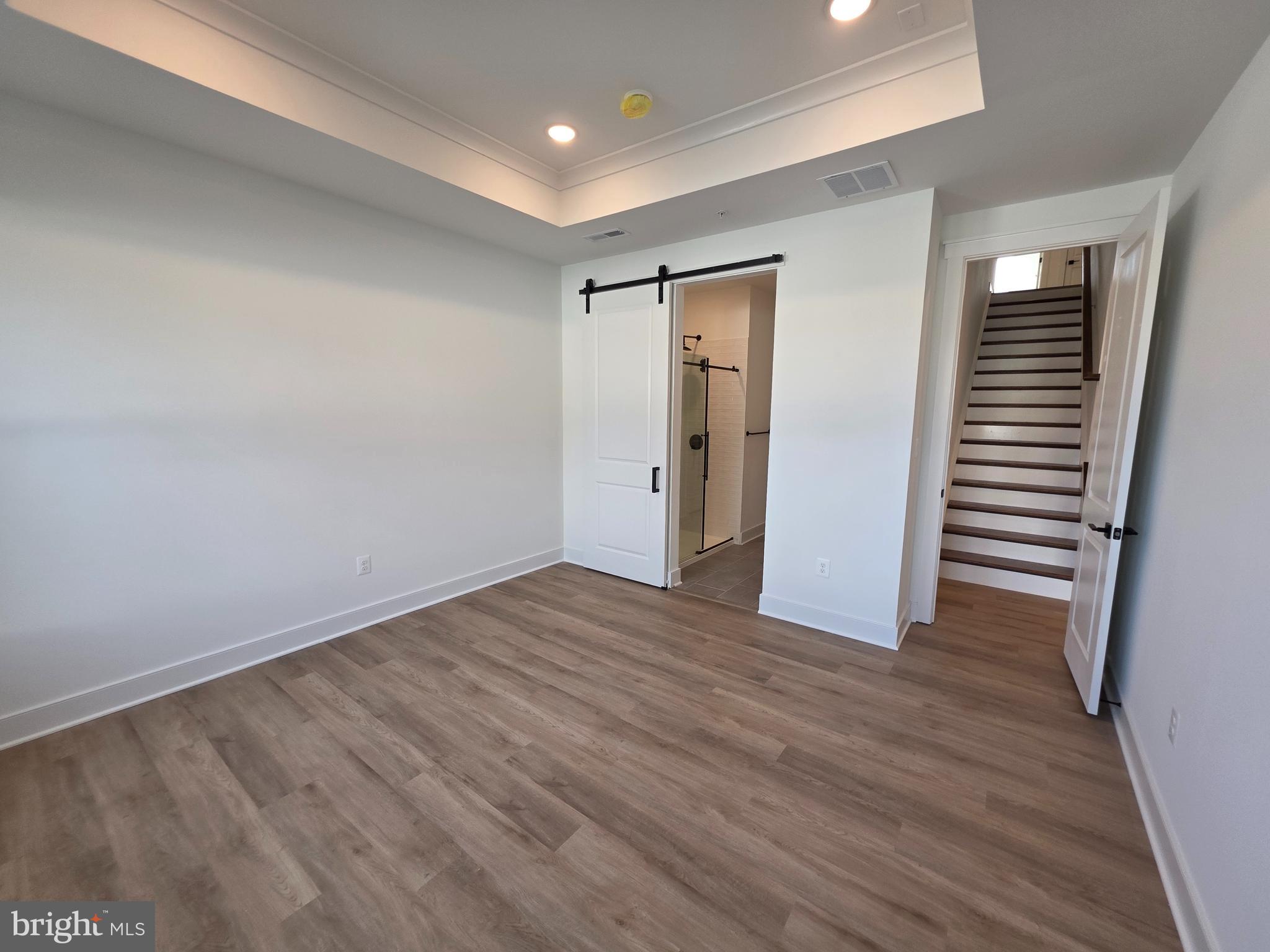 4817 Grandiflora Circle Perry Hall, MD 21128 - Photo 23 of 35 wooden floor in an empty room with a window