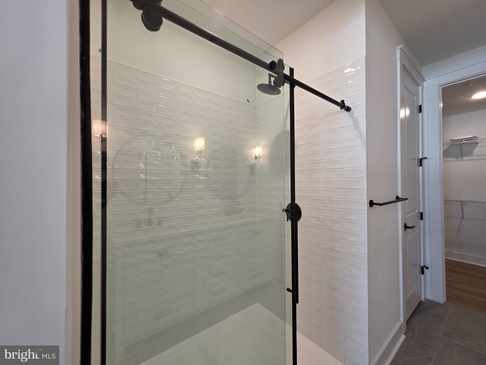 4817 Grandiflora Circle Perry Hall, MD 21128 - Photo 25 of 35 a bathroom with a glass shower door