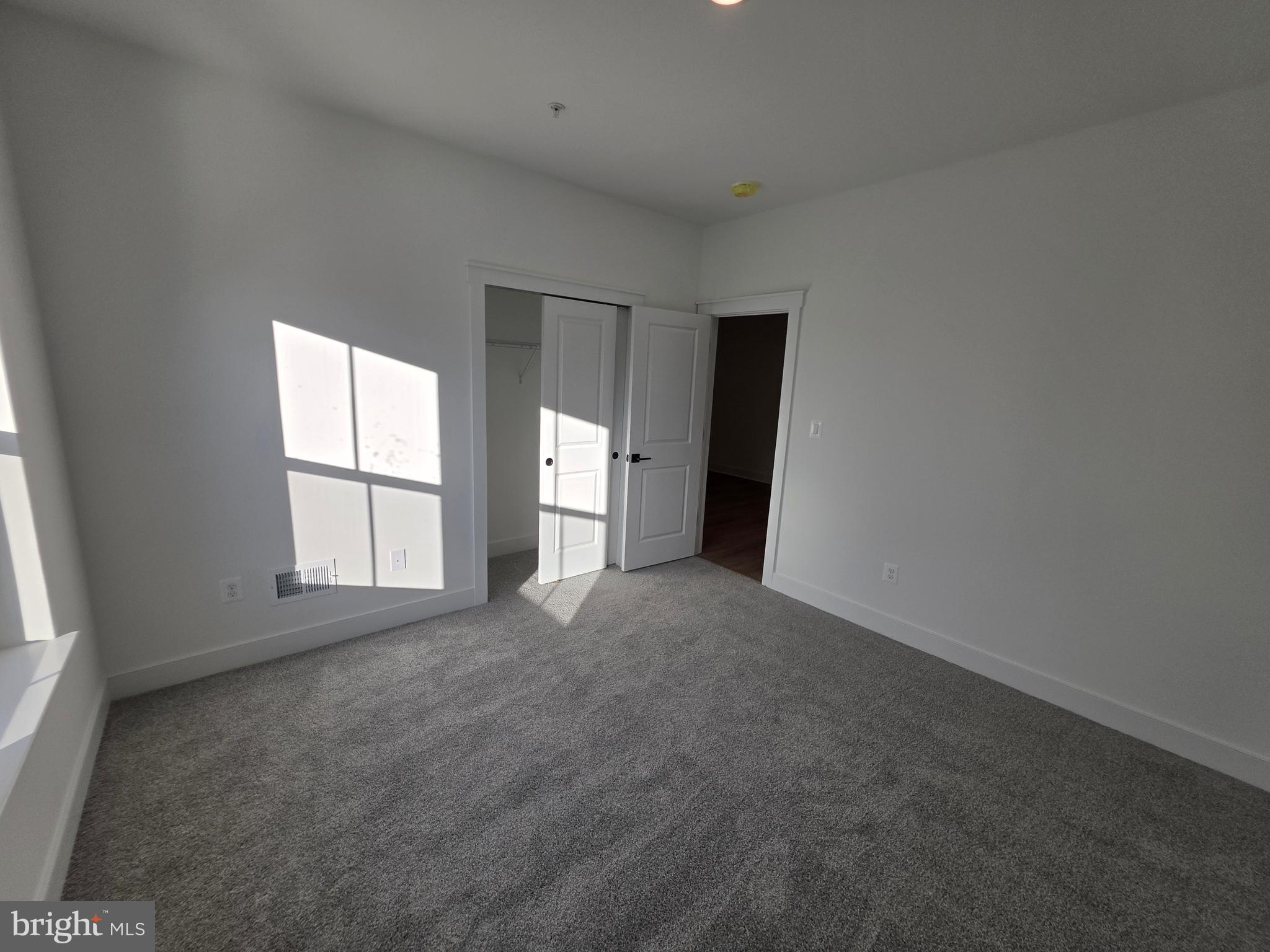 4817 Grandiflora Circle Perry Hall, MD 21128 - Photo 33 of 35 an empty room with windows