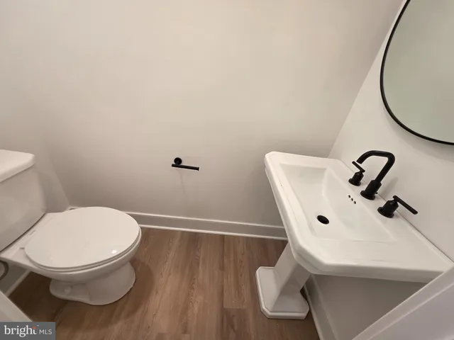 a bathroom with a toilet and a sink