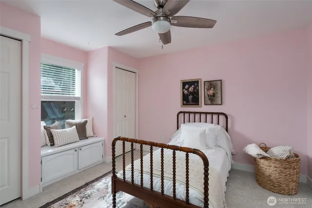 a bedroom with furniture and a window